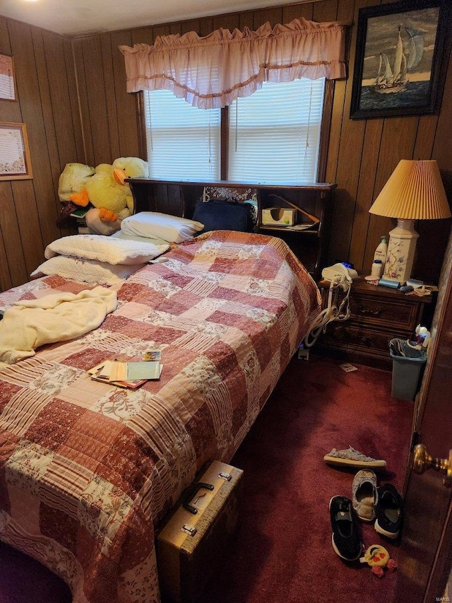 bedroom with carpet flooring and wooden walls