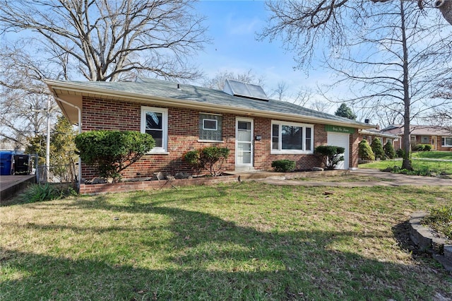 ranch-style house with brick siding, a front lawn, and an attached garage