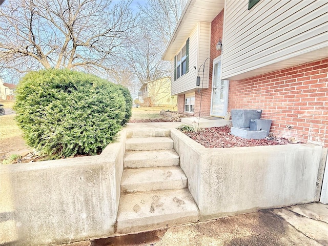 exterior space featuring brick siding