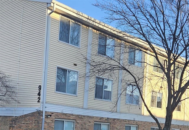 view of home's exterior featuring brick siding