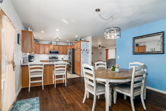 dining space with recessed lighting, a ceiling fan, dark wood-type flooring, and baseboards