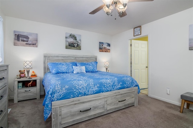 carpeted bedroom featuring ceiling fan and baseboards