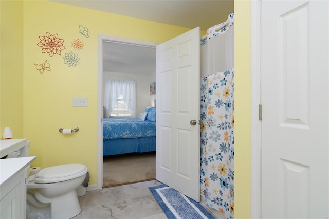 ensuite bathroom with ensuite bath, a shower with shower curtain, toilet, and vanity