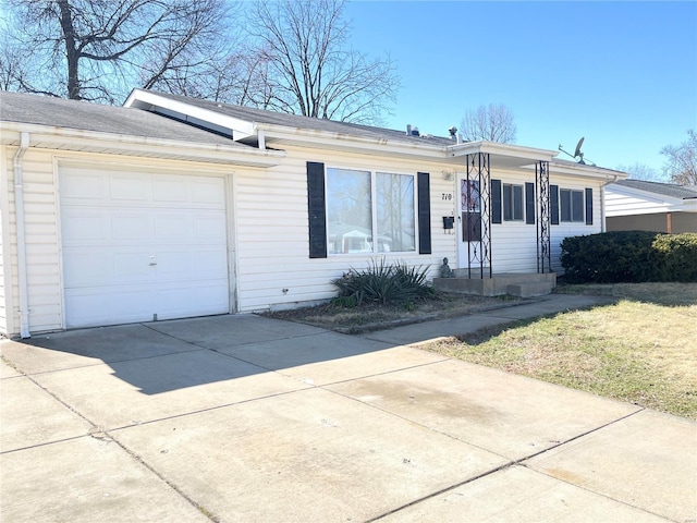 ranch-style home featuring driveway and an attached garage