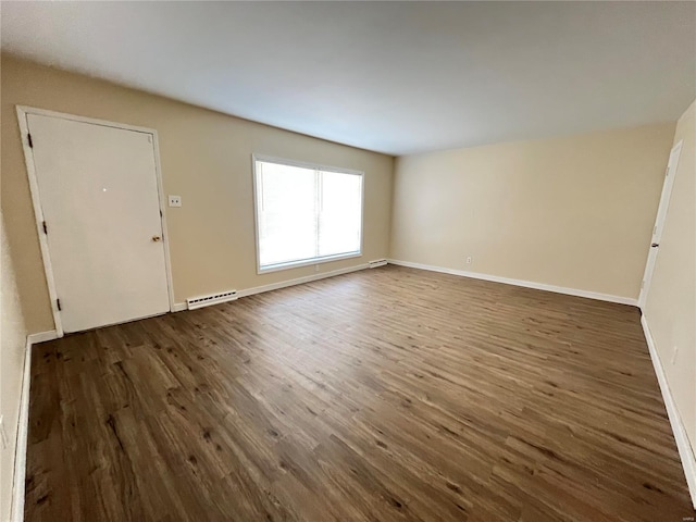 interior space with dark wood-style flooring, baseboards, and baseboard heating