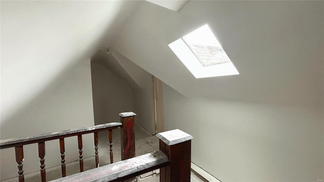 bonus room featuring vaulted ceiling with skylight