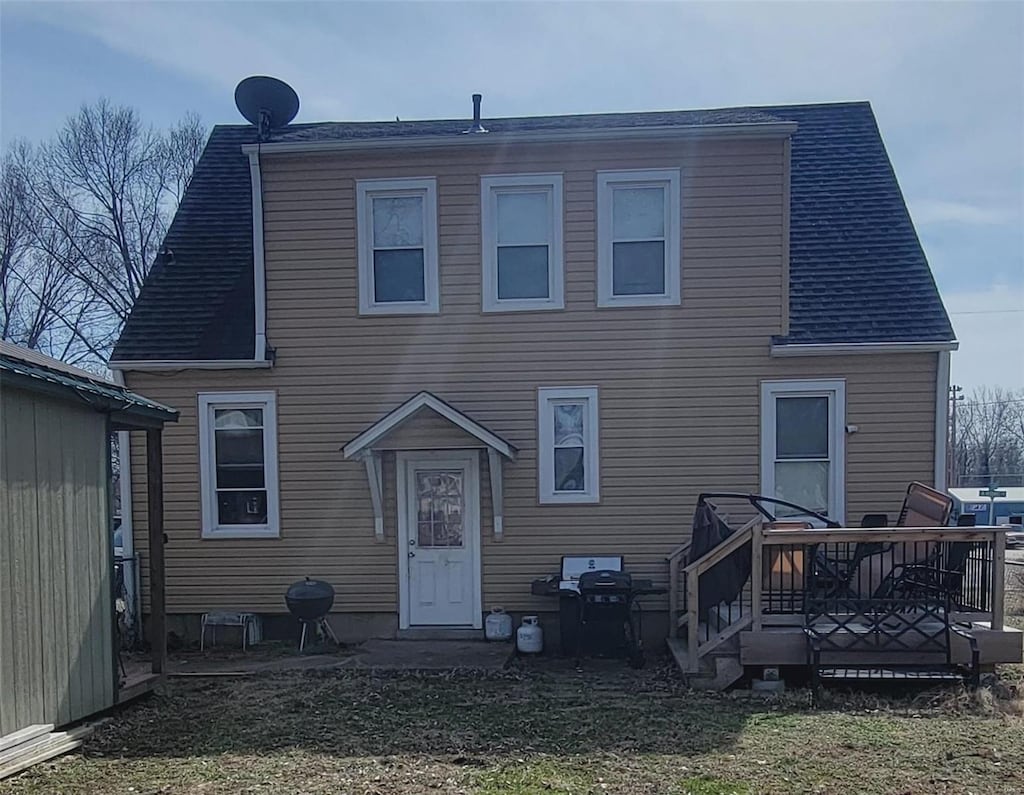 rear view of property with a deck