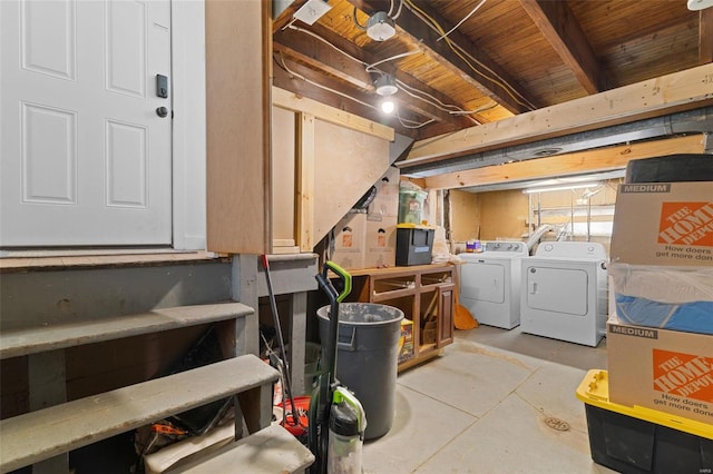 unfinished basement featuring washer and clothes dryer