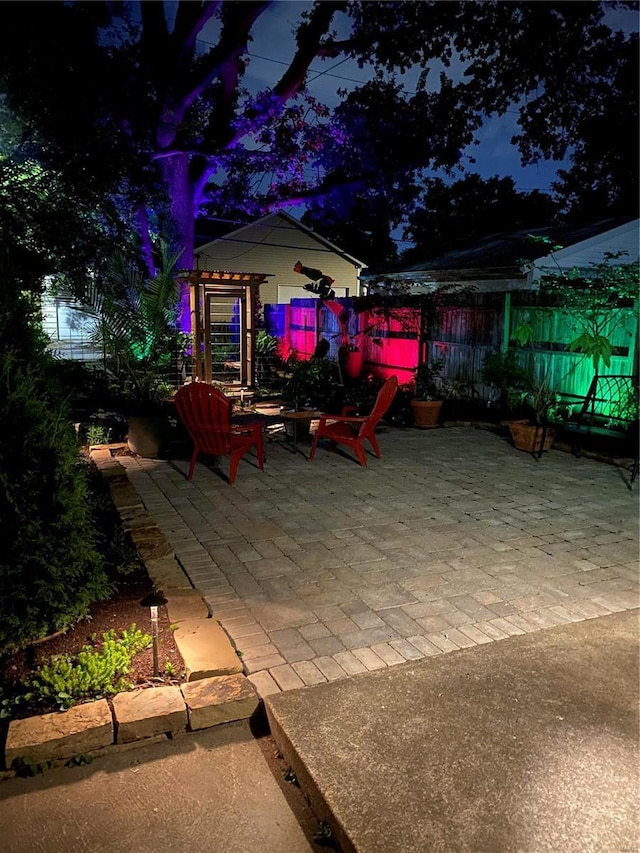 view of patio featuring fence