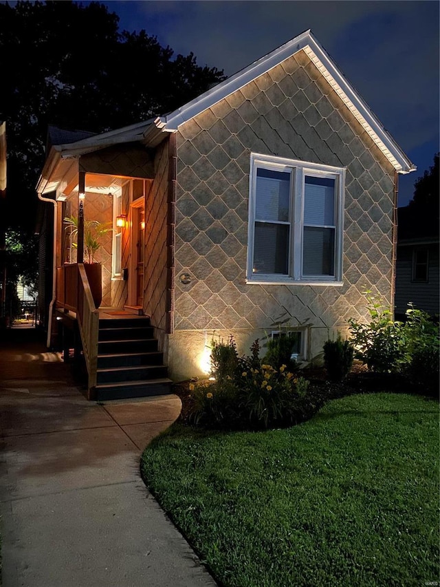 view of front of house with a lawn