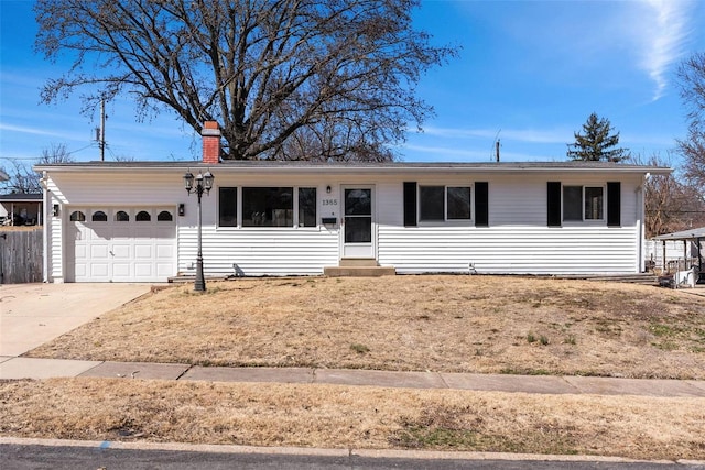 ranch-style home with entry steps, an attached garage, driveway, and a chimney