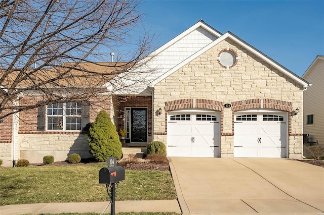 view of front of house with brick siding, a front lawn, an attached garage, and driveway