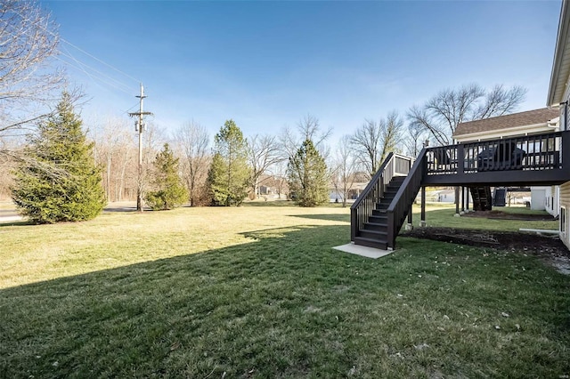 view of yard with stairs and a deck