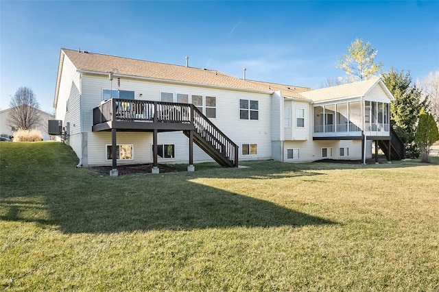 back of property with central air condition unit, a deck, stairs, and a sunroom