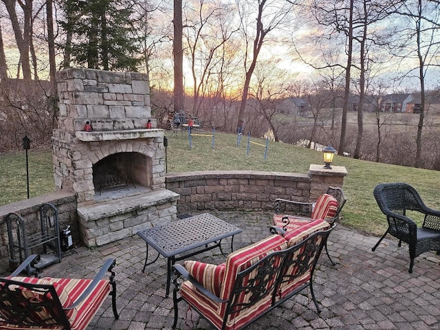 view of patio / terrace with an outdoor stone fireplace