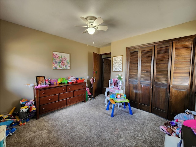 rec room with carpet floors and a ceiling fan