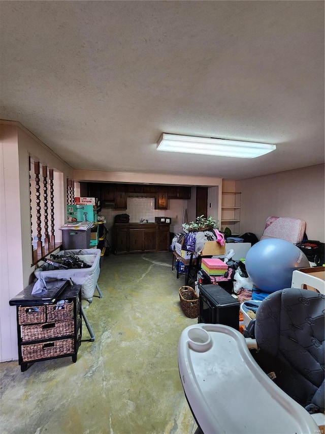 finished basement featuring a textured ceiling