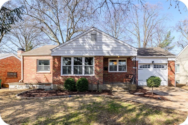 view of front of house featuring a garage, brick siding, and driveway