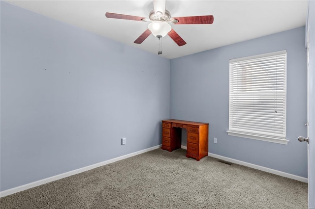 interior space featuring a ceiling fan, visible vents, carpet, and baseboards