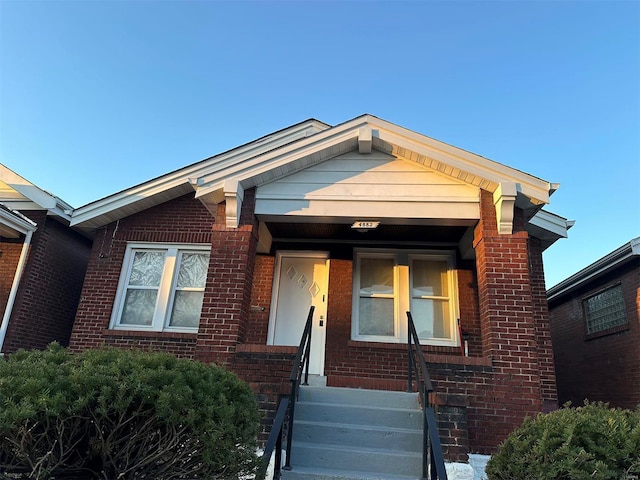 view of front of house with brick siding