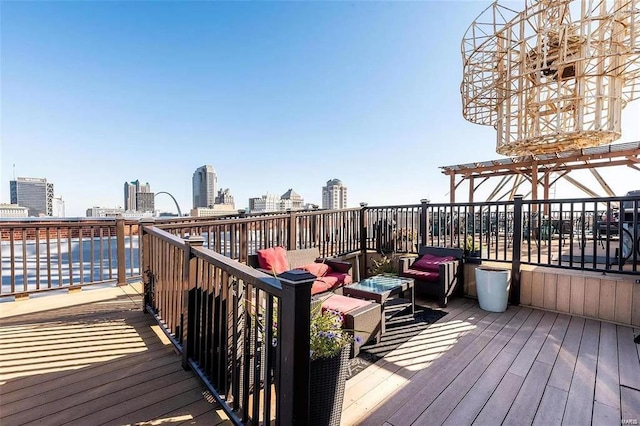 deck with a city view and a pergola