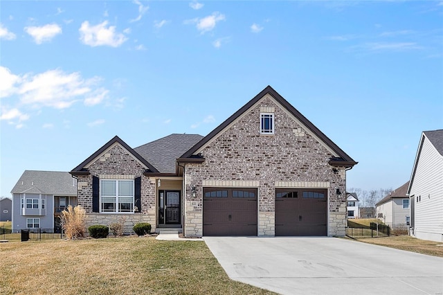 view of front facade featuring stone siding, driveway, a front yard, and fence