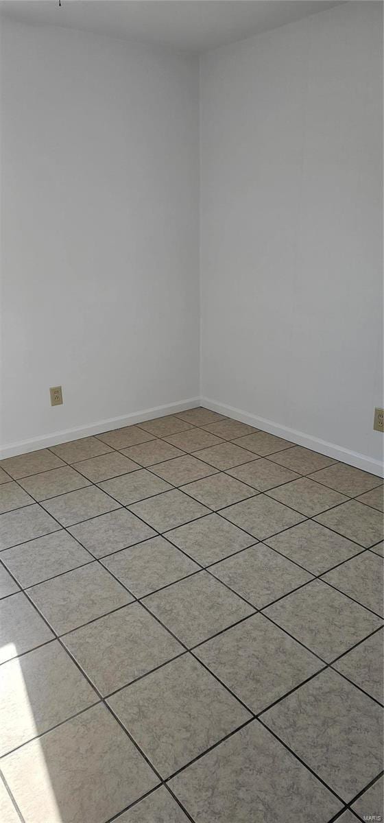 empty room with baseboards