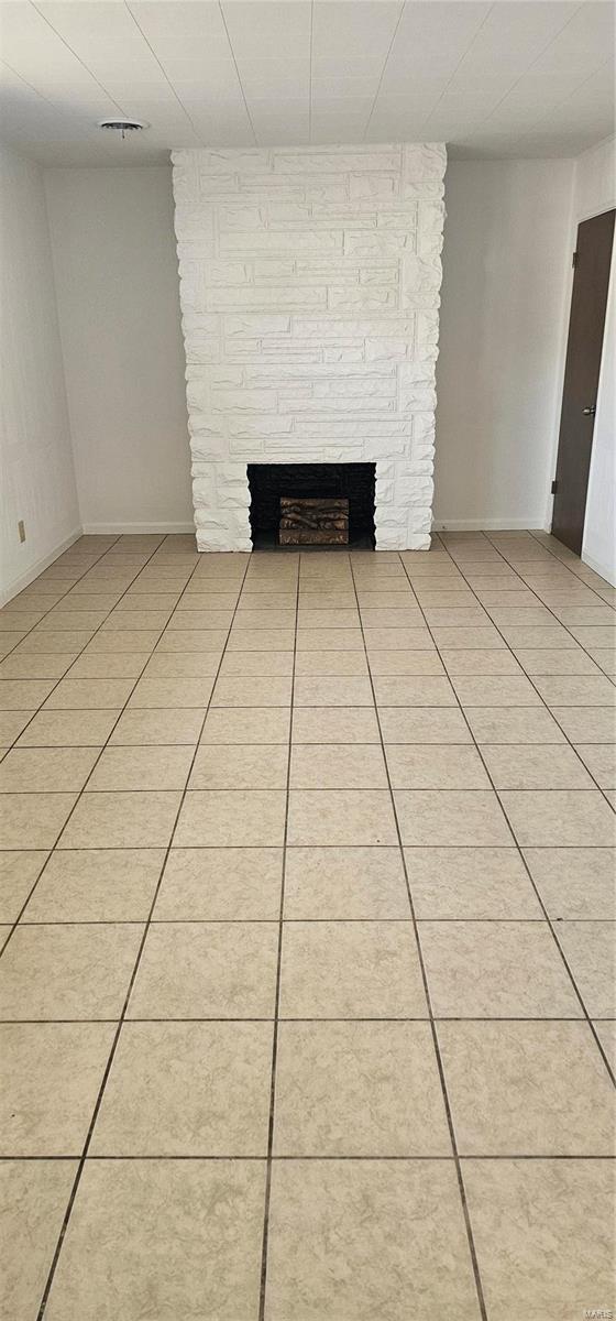 interior details featuring a fireplace and visible vents