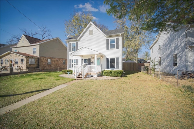 view of front of house featuring a lawn and a fenced backyard