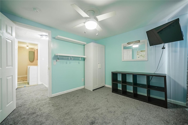 unfurnished bedroom with baseboards, carpet, and a ceiling fan