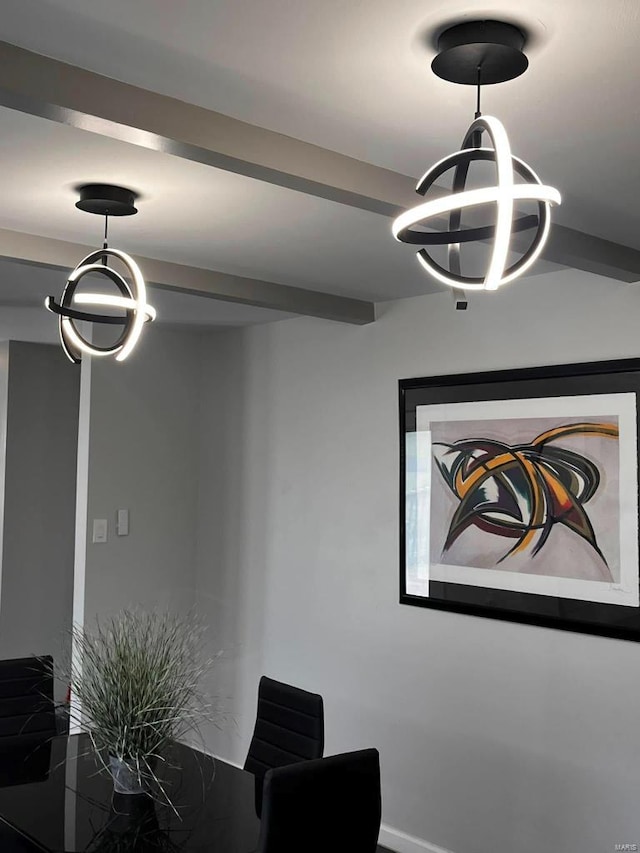dining area featuring an inviting chandelier and beam ceiling