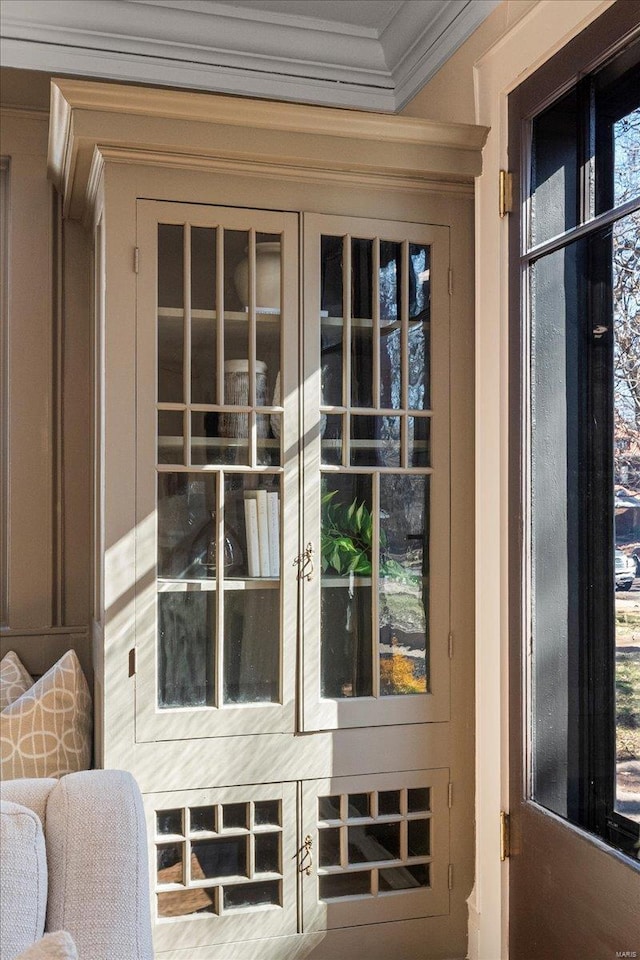 doorway featuring crown molding