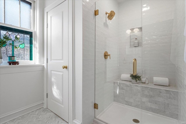 bathroom featuring a shower stall