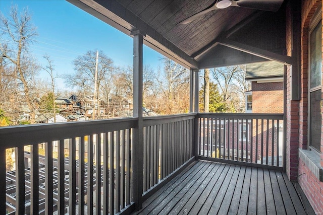 wooden terrace featuring a ceiling fan