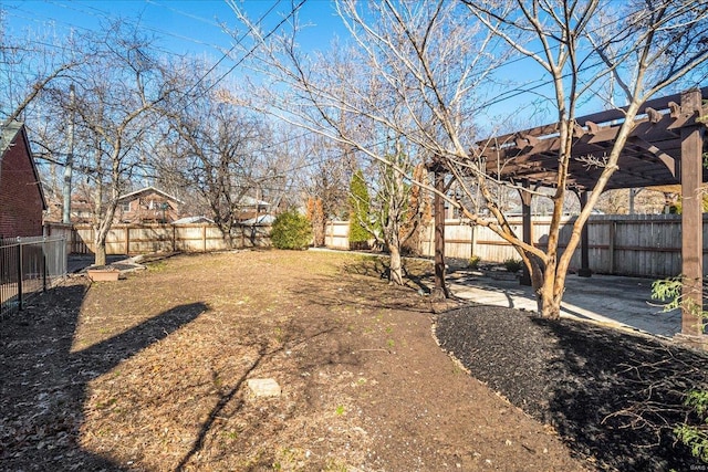 view of yard with a patio, a fenced backyard, and a pergola