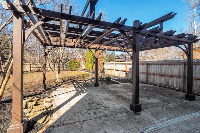 view of patio featuring a fenced backyard and a pergola