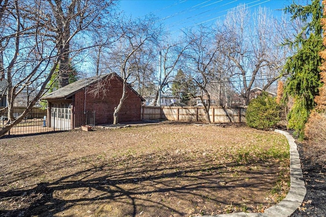 view of yard featuring an outbuilding and a fenced backyard