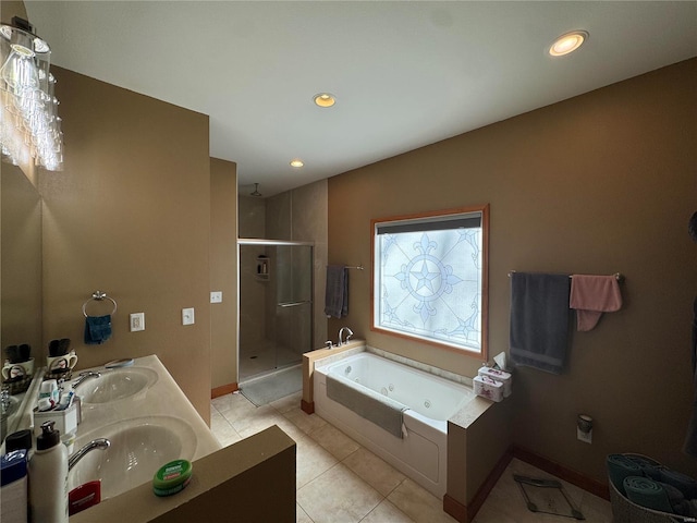 full bathroom featuring tile patterned flooring, a sink, double vanity, a tub with jets, and a stall shower