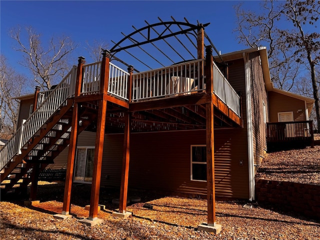 exterior space with stairway and a wooden deck