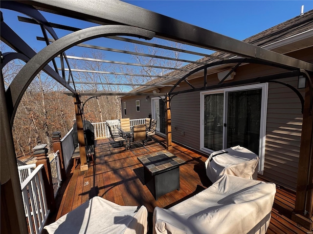 wooden terrace with outdoor dining area