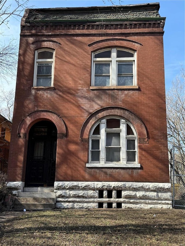 exterior space featuring brick siding