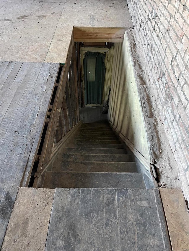 stairway with hardwood / wood-style floors