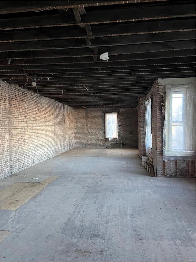 miscellaneous room featuring brick wall