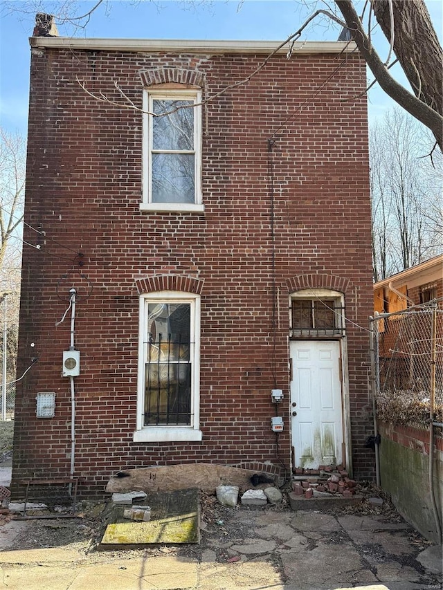 exterior space featuring brick siding