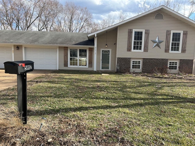 split level home with a front lawn, concrete driveway, and a garage