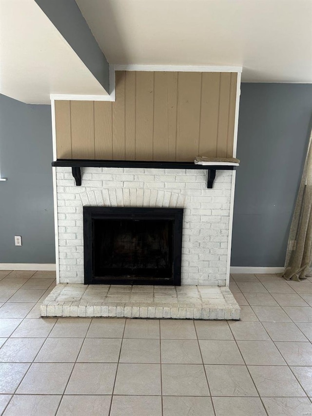 interior details with a brick fireplace and baseboards