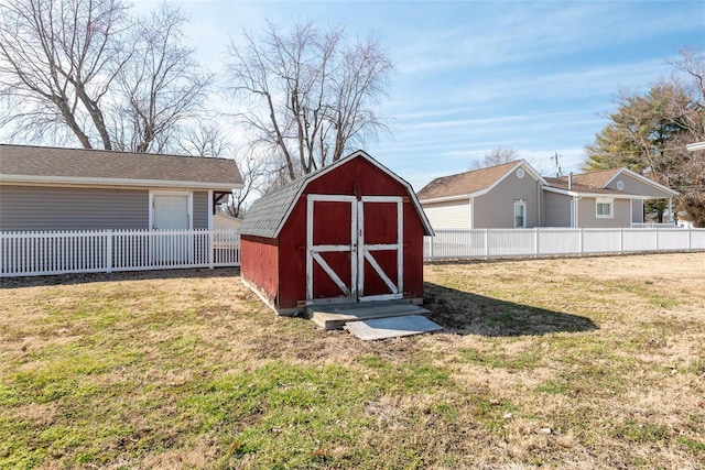 view of shed with fence