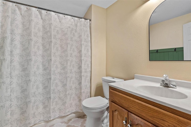 bathroom with vanity, toilet, and a shower with curtain