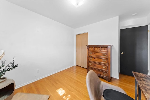 office area with light wood-type flooring and baseboards