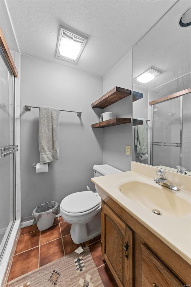 full bath with tile patterned flooring, visible vents, toilet, a stall shower, and vanity